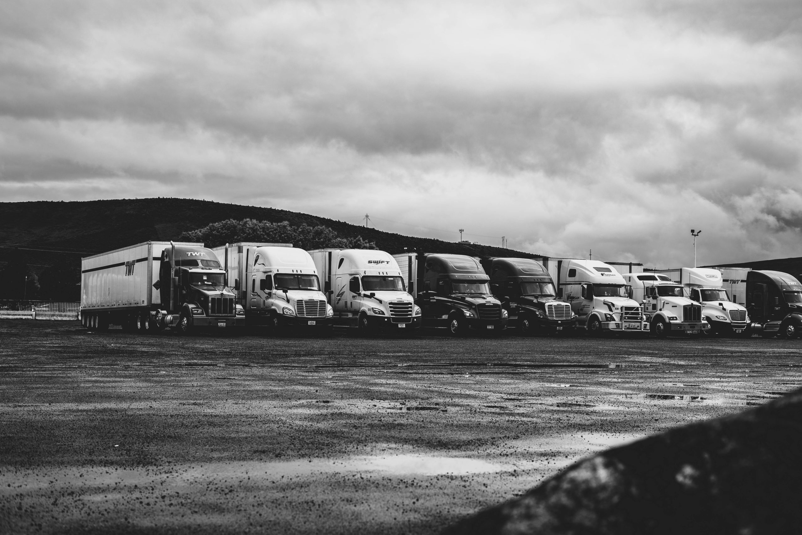 Trucks under clouds